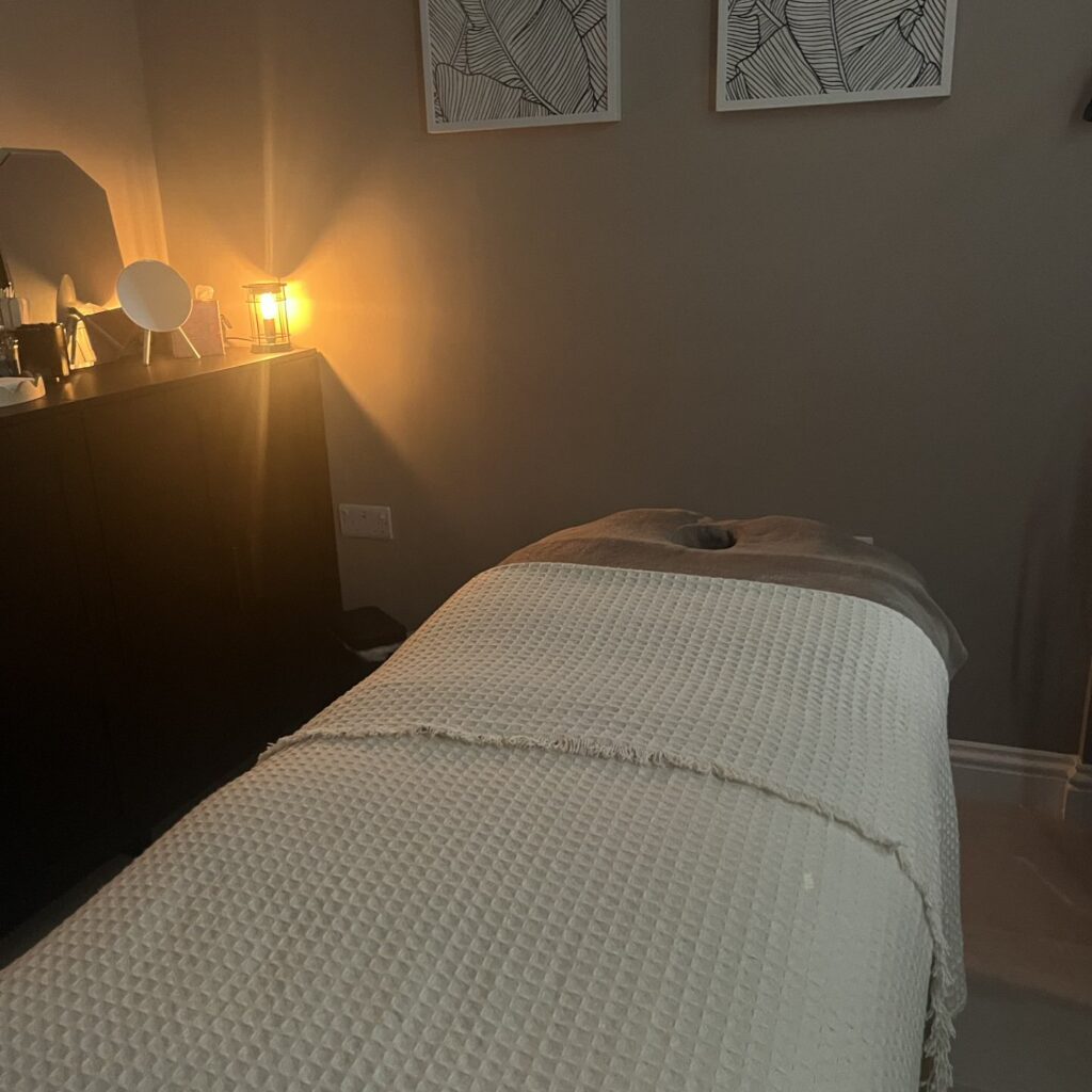 Treatment bed in softly lit studio